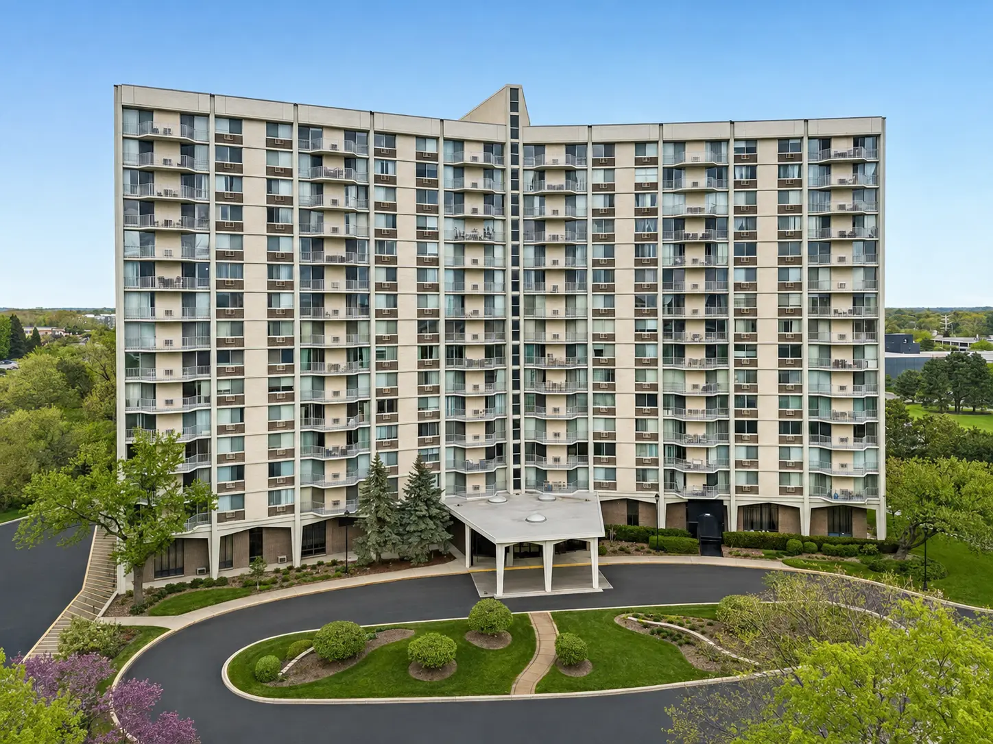 High-rise building and landscaped entrance in Oakbrook Terrace, Illinois